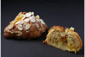 Polished cafe serving French-trained pastry — supporting dish in this style