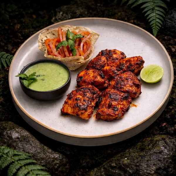 Dramatic nature-immersed restaurant photography — supporting dish in this style